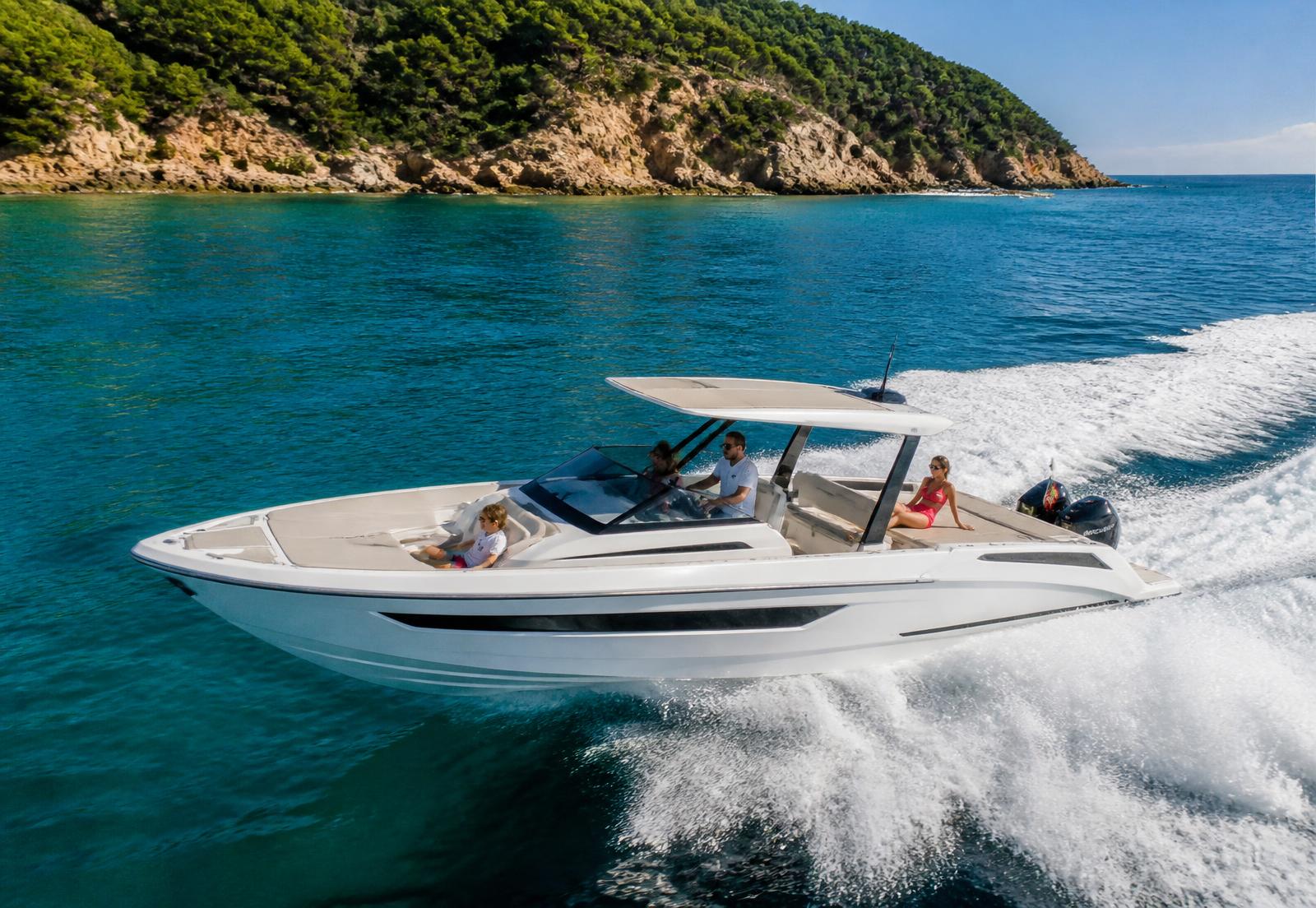 Modern white boat cruising on turquoise Mediterranean water